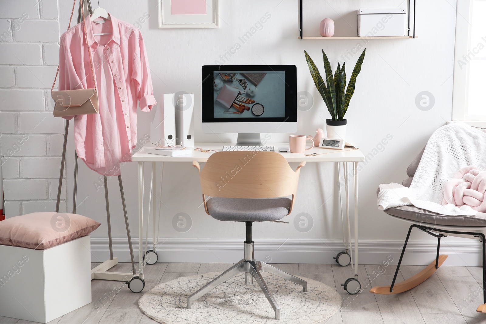 Photo of Comfortable workplace with computer on desk in home office