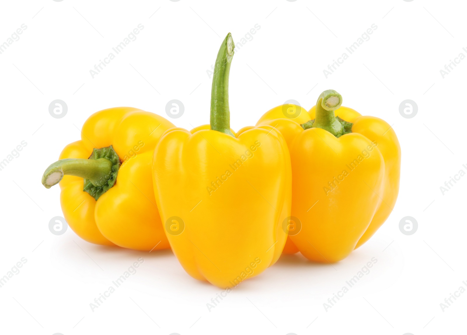 Photo of Ripe yellow bell peppers isolated on white