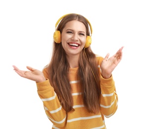 Young woman listening to music with headphones on white background