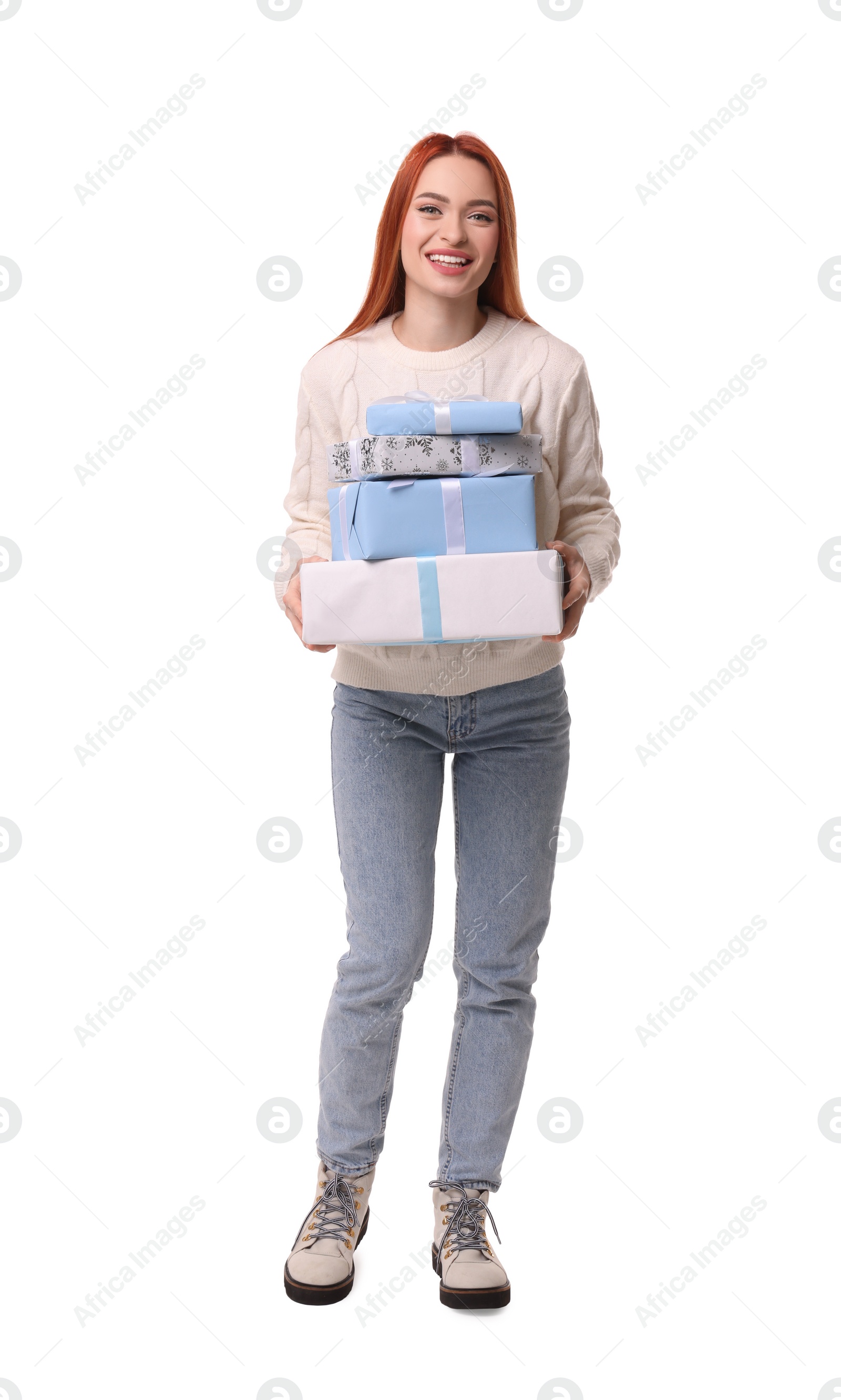 Photo of Young woman in sweater with Christmas gifts on white background