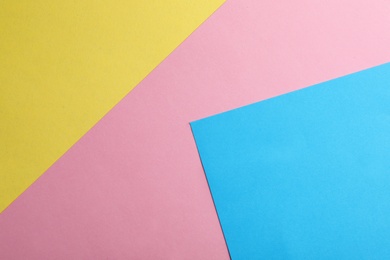 Colorful paper sheets as background, top view