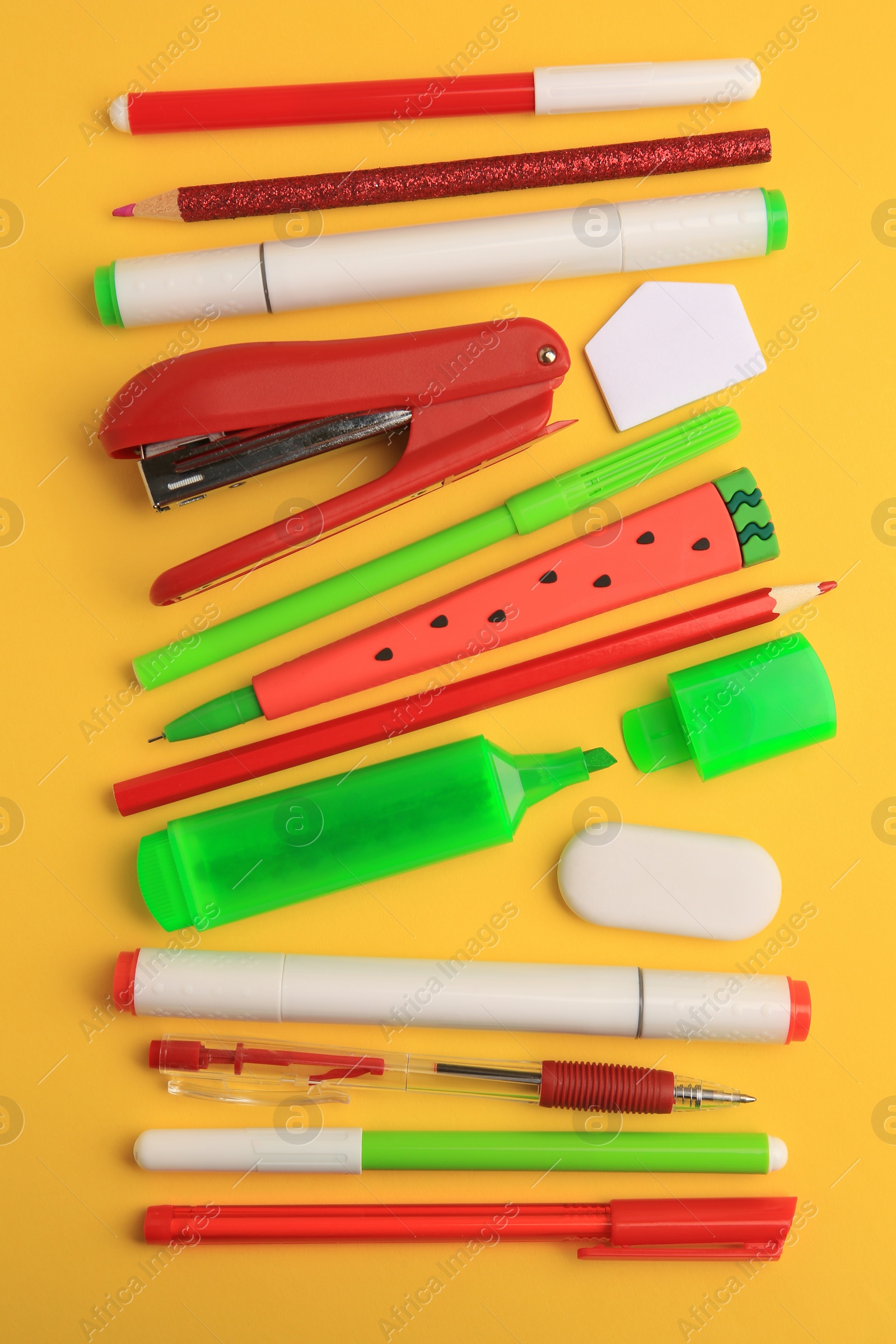 Photo of Flat lay composition with different school stationery on orange background. Back to school