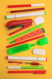 Photo of Flat lay composition with different school stationery on orange background. Back to school