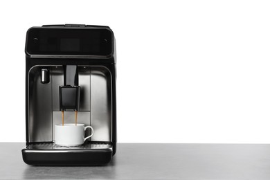 Photo of Making coffee with modern espresso machine on table against white background. Space for text