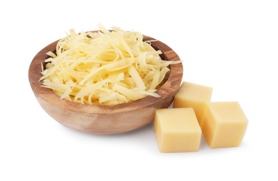 Grated cheese in bowl and pieces of one isolated on white