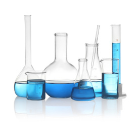 Different laboratory glassware with light blue liquid isolated on white