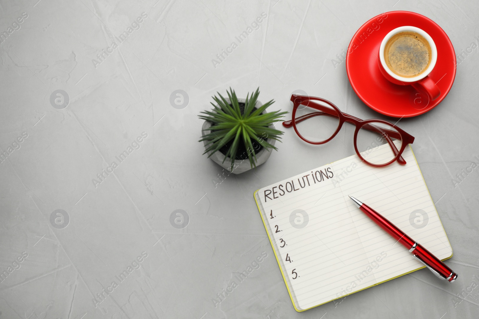 Photo of Making new year's resolutions. Flat lay composition with notebook on light grey table