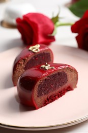 St. Valentine's Day. Pieces of delicious cake served on table, closeup