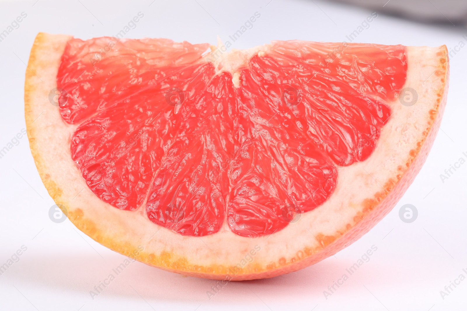 Photo of Cut ripe grapefruit isolated on white. Citrus fruit