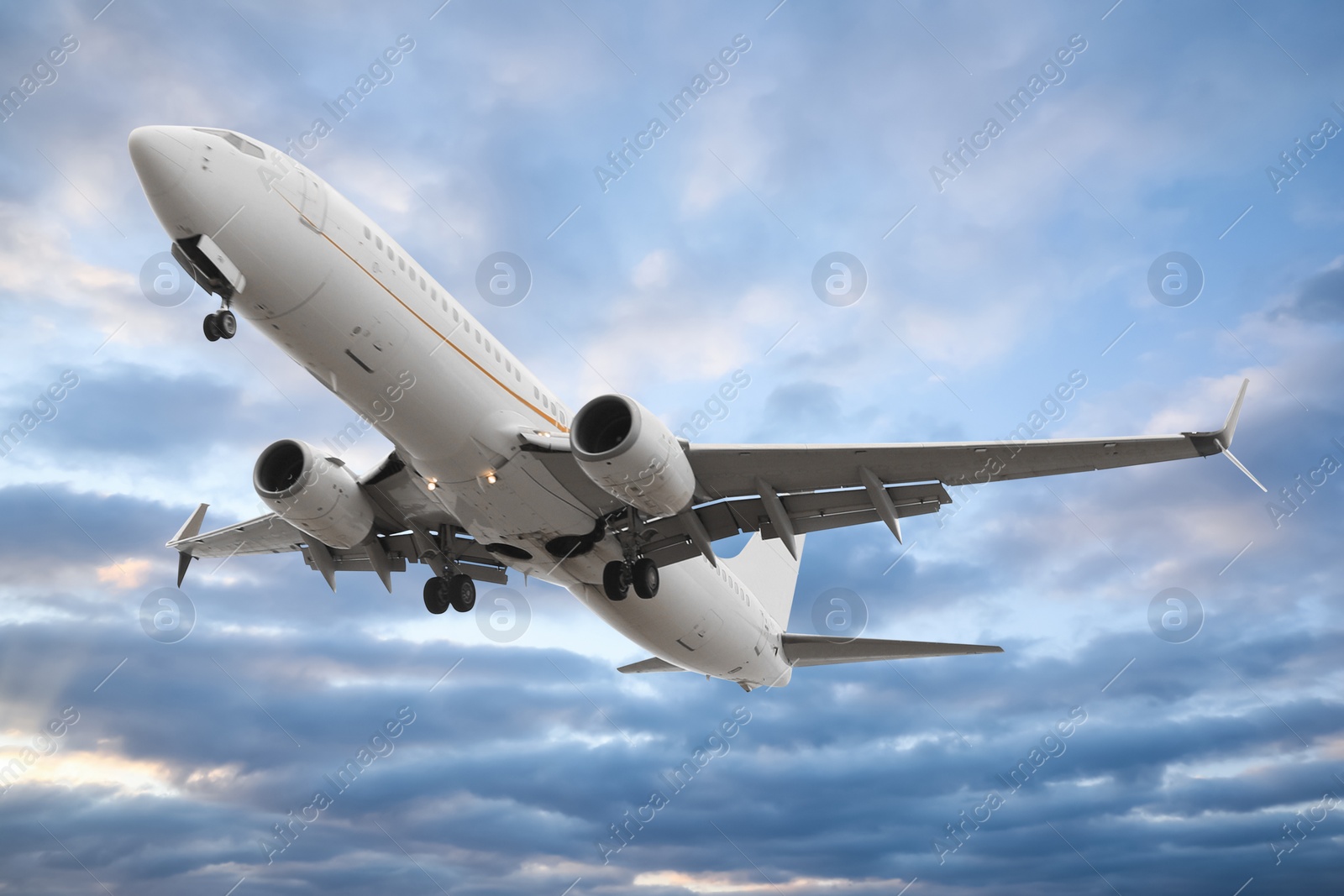 Image of Plane in sky during sunset, low angle view