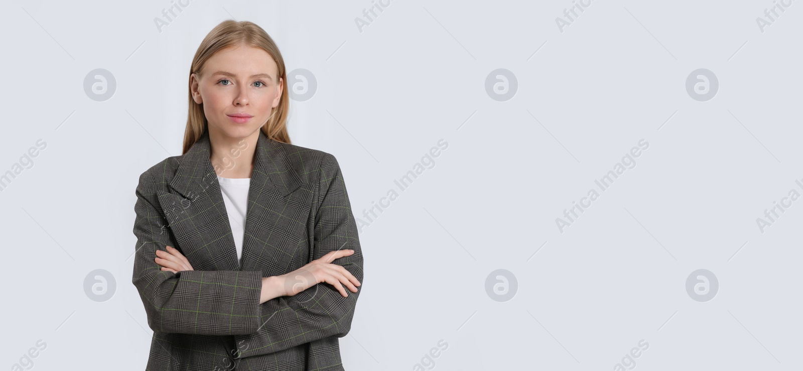 Image of Portrait of beautiful young woman on light background. Banner design with space for text
