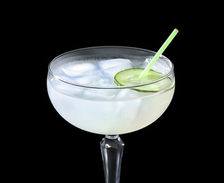 Photo of Glass of delicious cucumber martini with ice on dark background, closeup