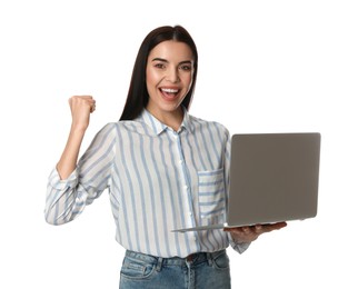 Emotional young woman with modern laptop on white background