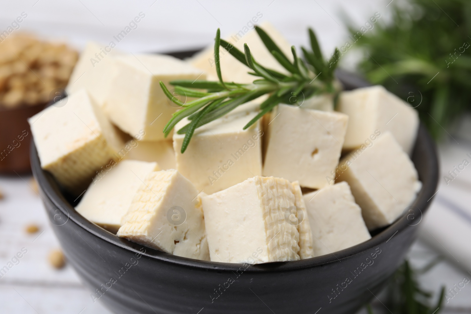 Photo of Delicious tofu cheese in bowl, closeup view