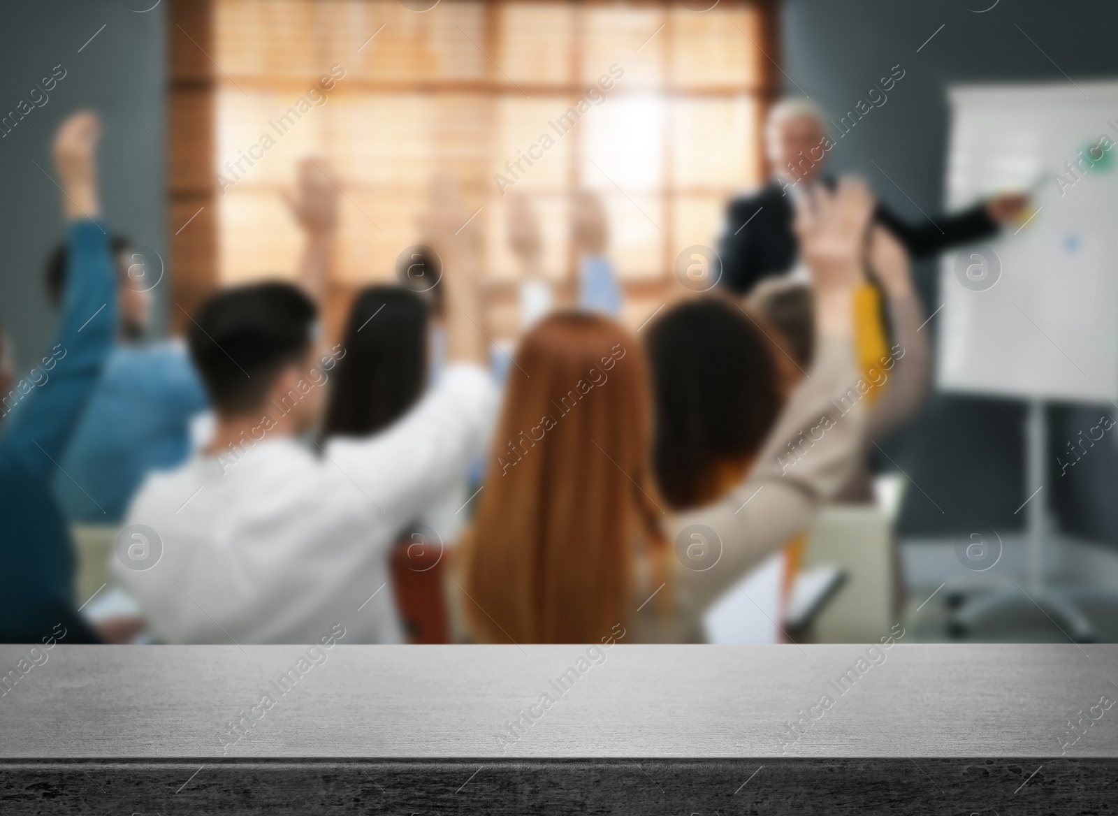 Image of Empty stone surface and blurred view of seminar in modern office, closeup. Space for text 