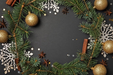 Photo of Flat lay composition with Christmas decor and space for text on dark background. Festive winter design