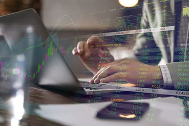 Stock exchange. Man using laptop at table and illustration of rating graph