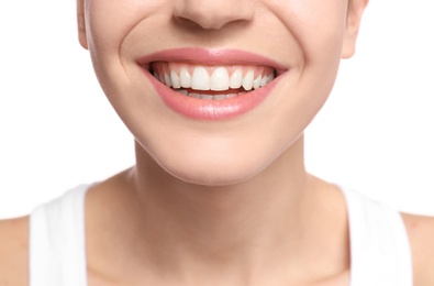 Photo of Young woman with beautiful smile on white background, closeup. Teeth whitening