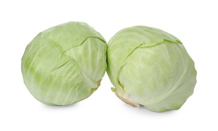 Photo of Whole fresh ripe cabbages isolated on white