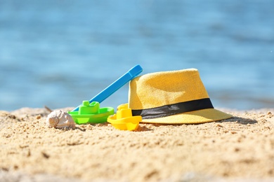 Photo of Composition with beach objects on sand against blurred background