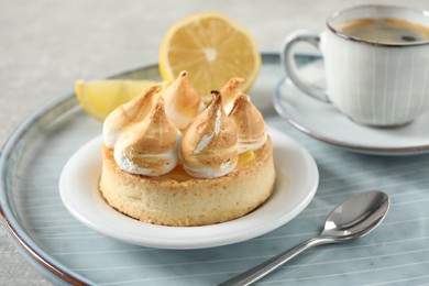 Photo of Delicious lemon meringue pie on tray, closeup