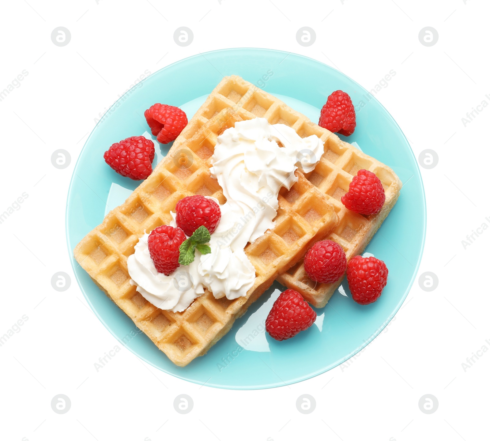 Photo of Plate with yummy waffles, whipped cream and raspberries on white background, top view