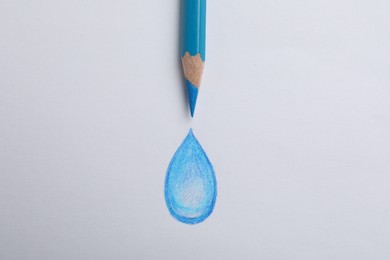 Drawing of water drop and light blue pencil on white background, top view