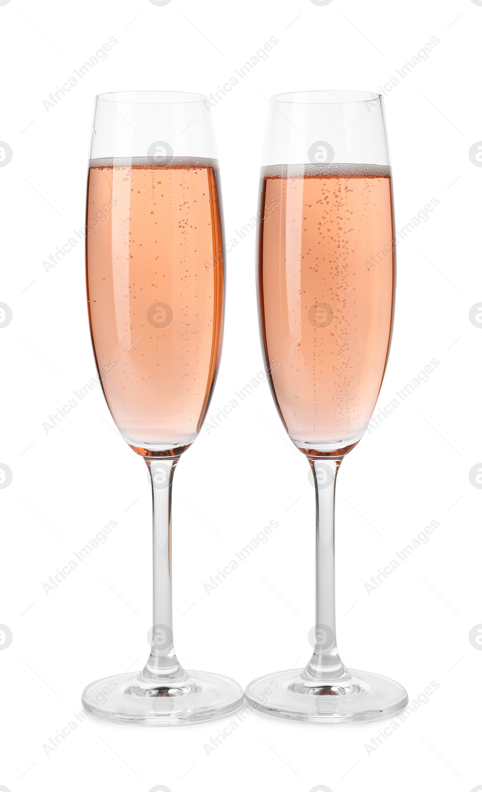 Photo of Glasses of rose champagne isolated on white