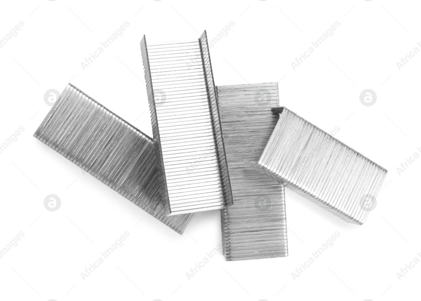 Photo of Many staple gun refills isolated on white, top view