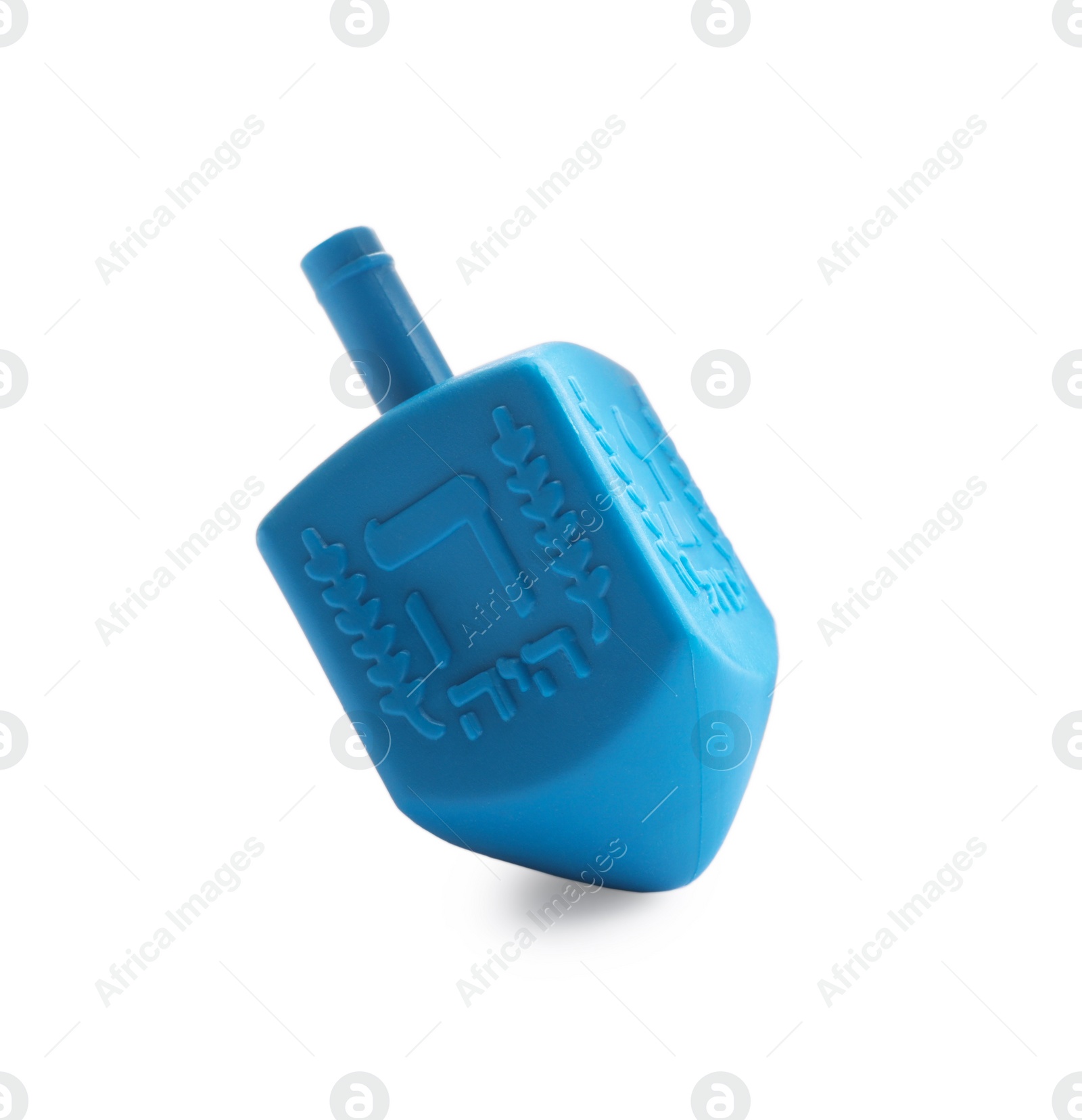 Photo of One light blue dreidel isolated on white. Traditional Hanukkah game