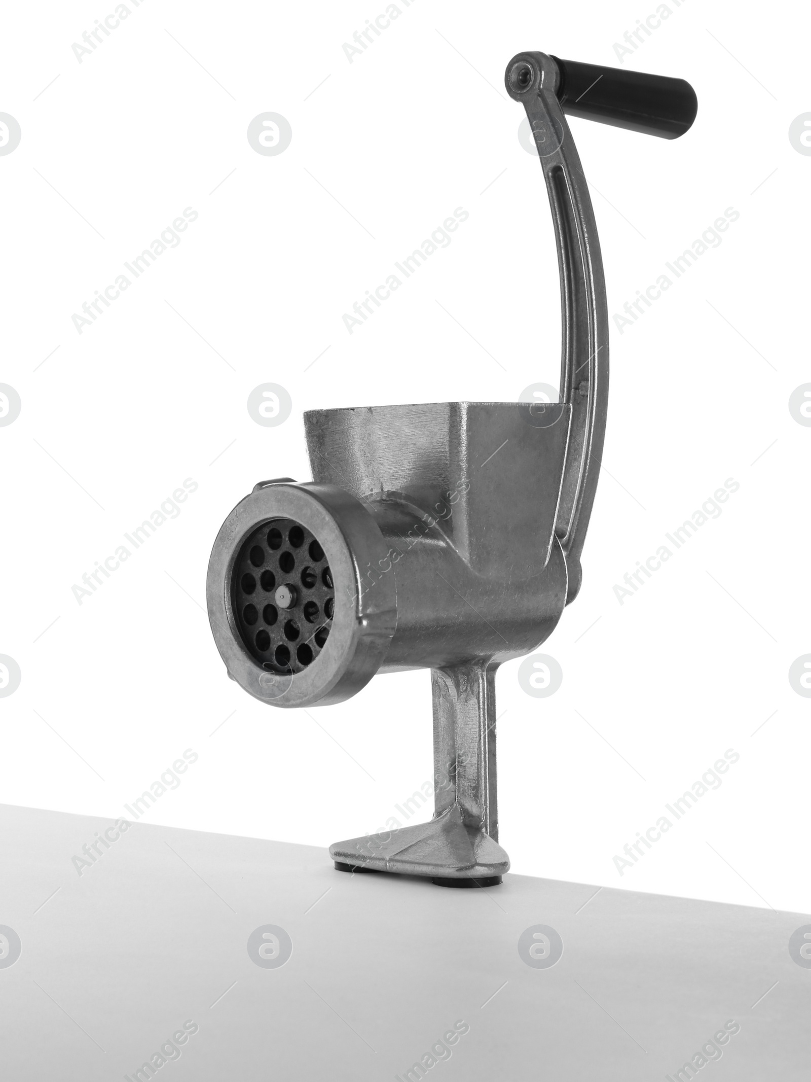 Photo of Metal manual meat grinder isolated on white