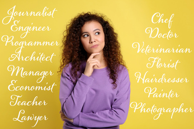 Thoughtful African American woman choosing profession on yellow background