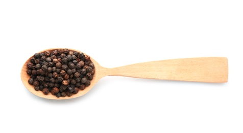 Wooden spoon with black pepper grains on white background, top view