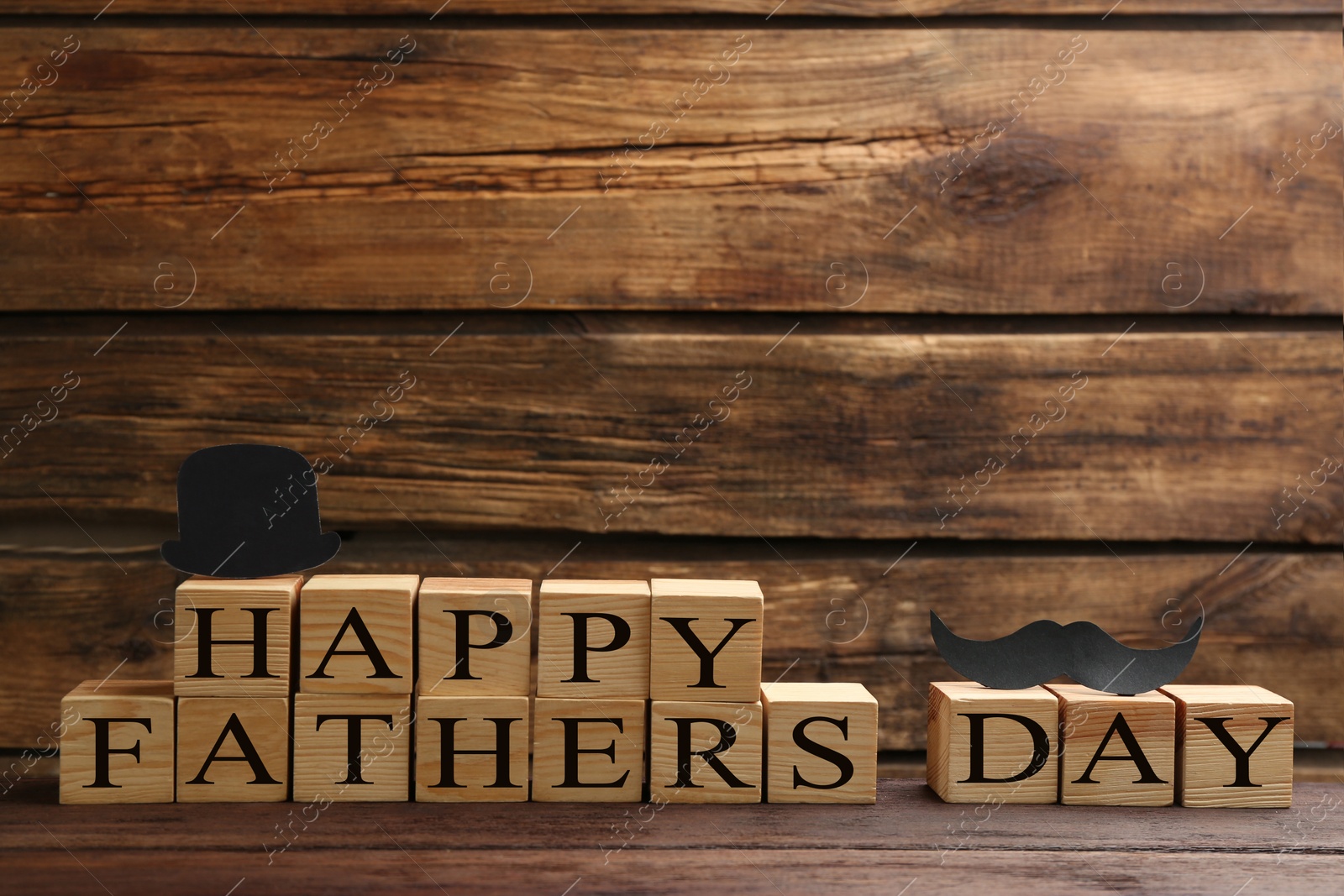 Photo of Phrase HAPPY FATHER'S DAY made with cubes on wooden background. Space for text