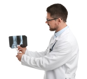 Orthopedist holding X-ray picture on white background