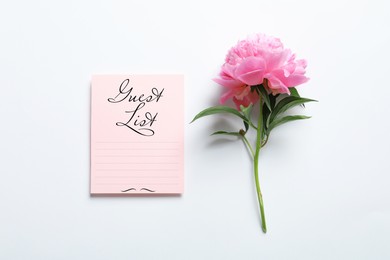 Image of Guest list and beautiful peony on white background, top view