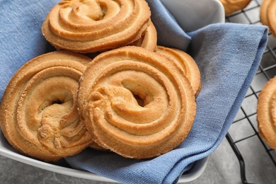 Photo of Bowl with Danish butter cookies on table, closeup