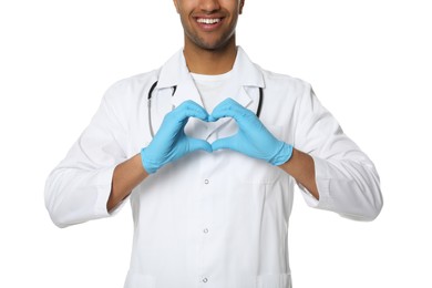 Photo of Doctor or medical assistant (male nurse) in uniform making heart shape with hands on white background, closeup