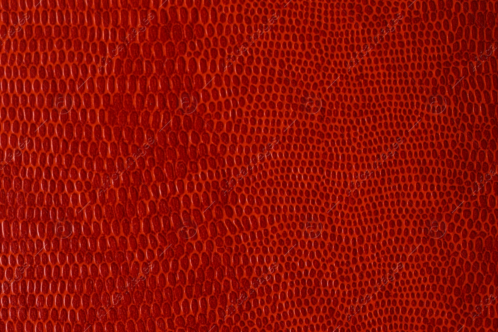 Photo of Orange textured surface as background, closeup view