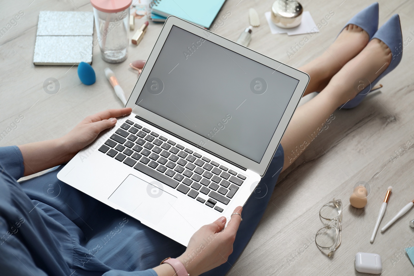 Photo of Beauty blogger with laptop on floor, closeup