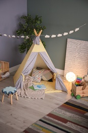 Modern room interior with play tent for child