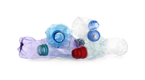 Pile of crumpled bottles isolated on white. Plastic recycling