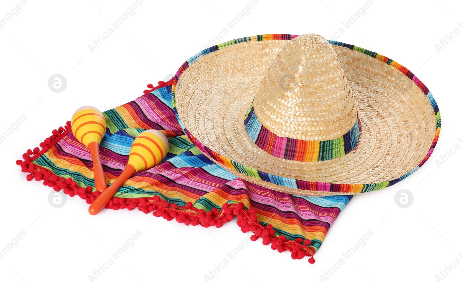 Photo of Mexican sombrero hat, maracas and colorful poncho isolated on white