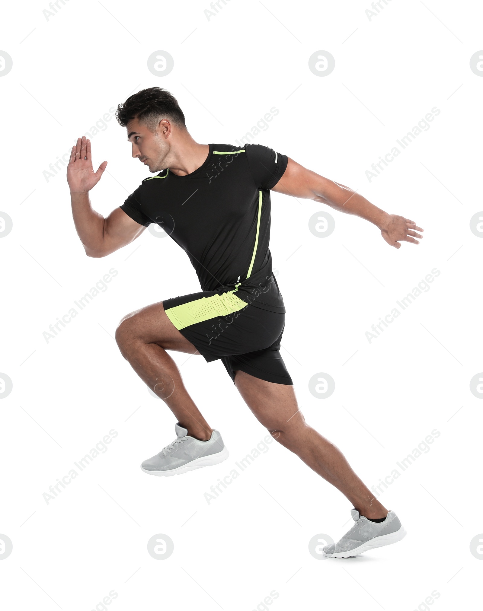 Photo of Sporty young man running on white background