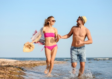 Young couple spending time together on beach