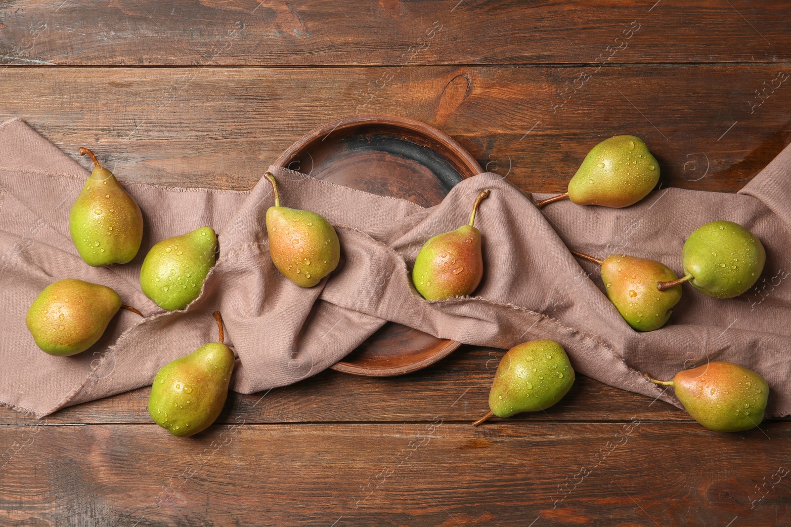 Photo of Flat lay composition with ripe pears on wooden background