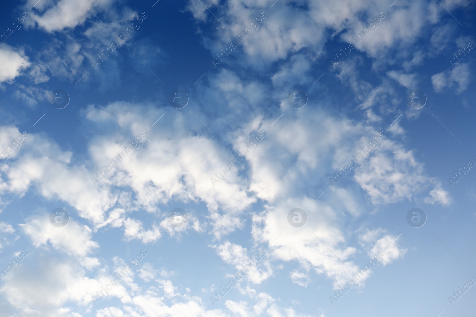 Photo of Picturesque view of beautiful fluffy clouds in light blue sky