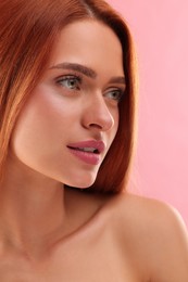 Portrait of beautiful young woman on pink background, closeup