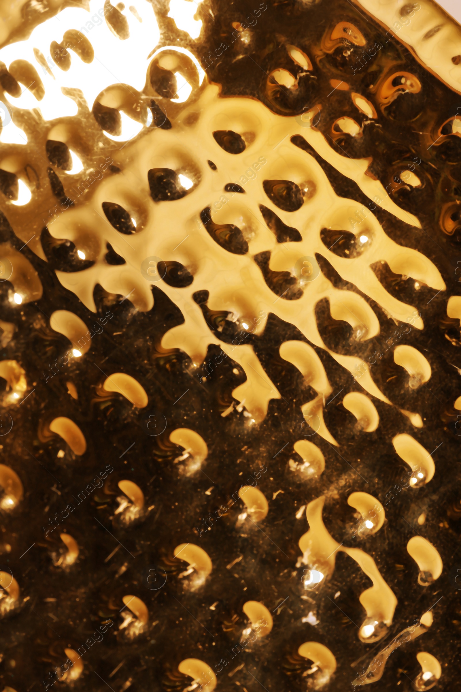 Photo of Closeup view of shiny golden surface as background