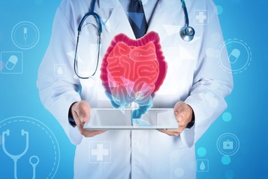 Image of Gastroenterologist with tablet and virtual image of intestine on turquoise background, closeup